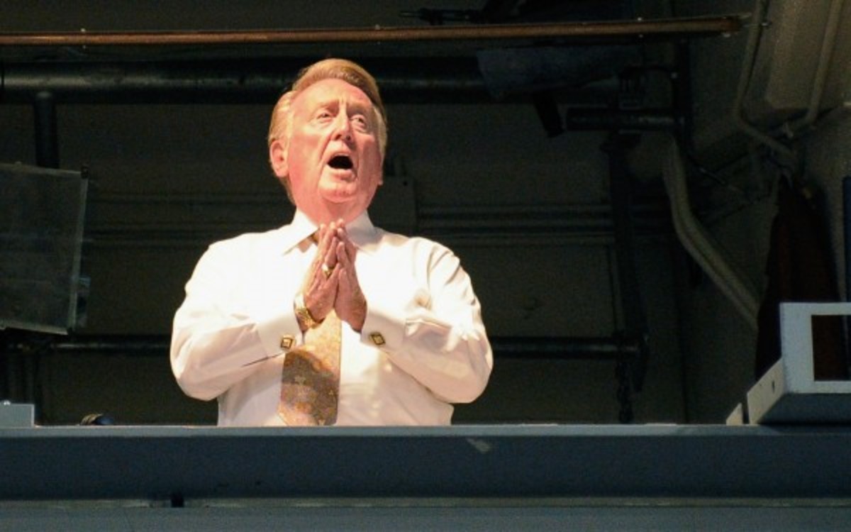 Vin Scully, 85, will broadcast another season of Dodgers' games. (Kevork Djansezian/Getty Images)