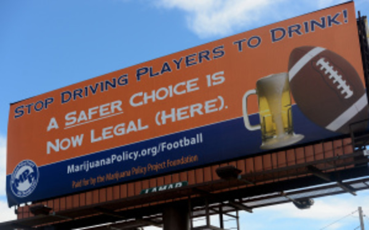 A marijuana advocacy group took out space on a billboard outside the Broncos' Mile High stadium a day before their season opener. (Helen H. Richardson/Getty Images)