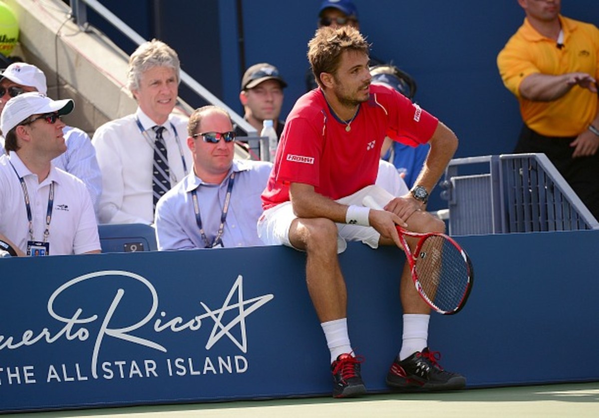Wawrinka takes a breather in the middle of a 20-minute game. (Emmanuel Dunand/AFP/Getty Images)
