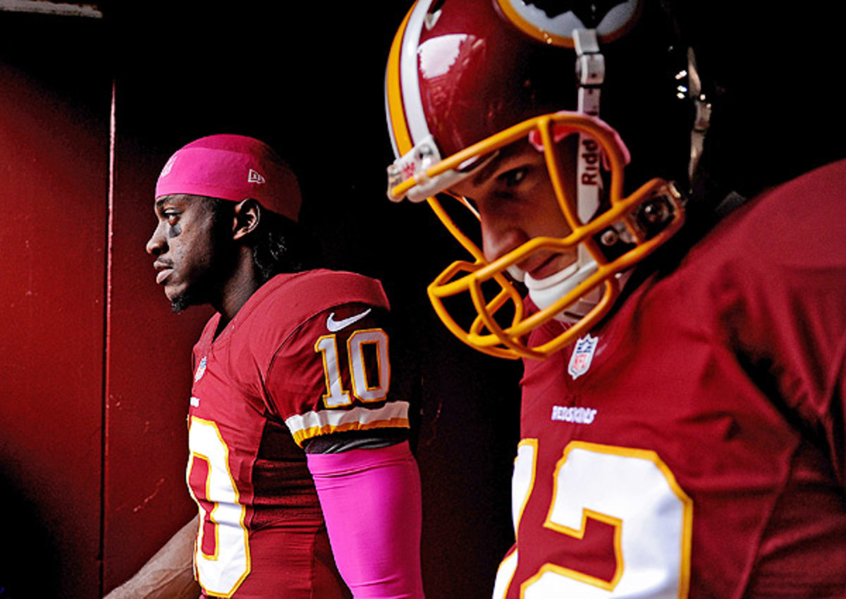 Kirk Cousins (right) believes the Redskins should stick with Robert Griffin III at QB. 