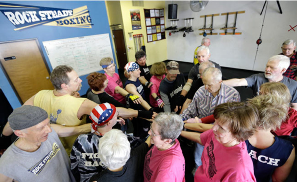 Class participates gather after a workout at Rock Steady Boxing in Indianapolis.
