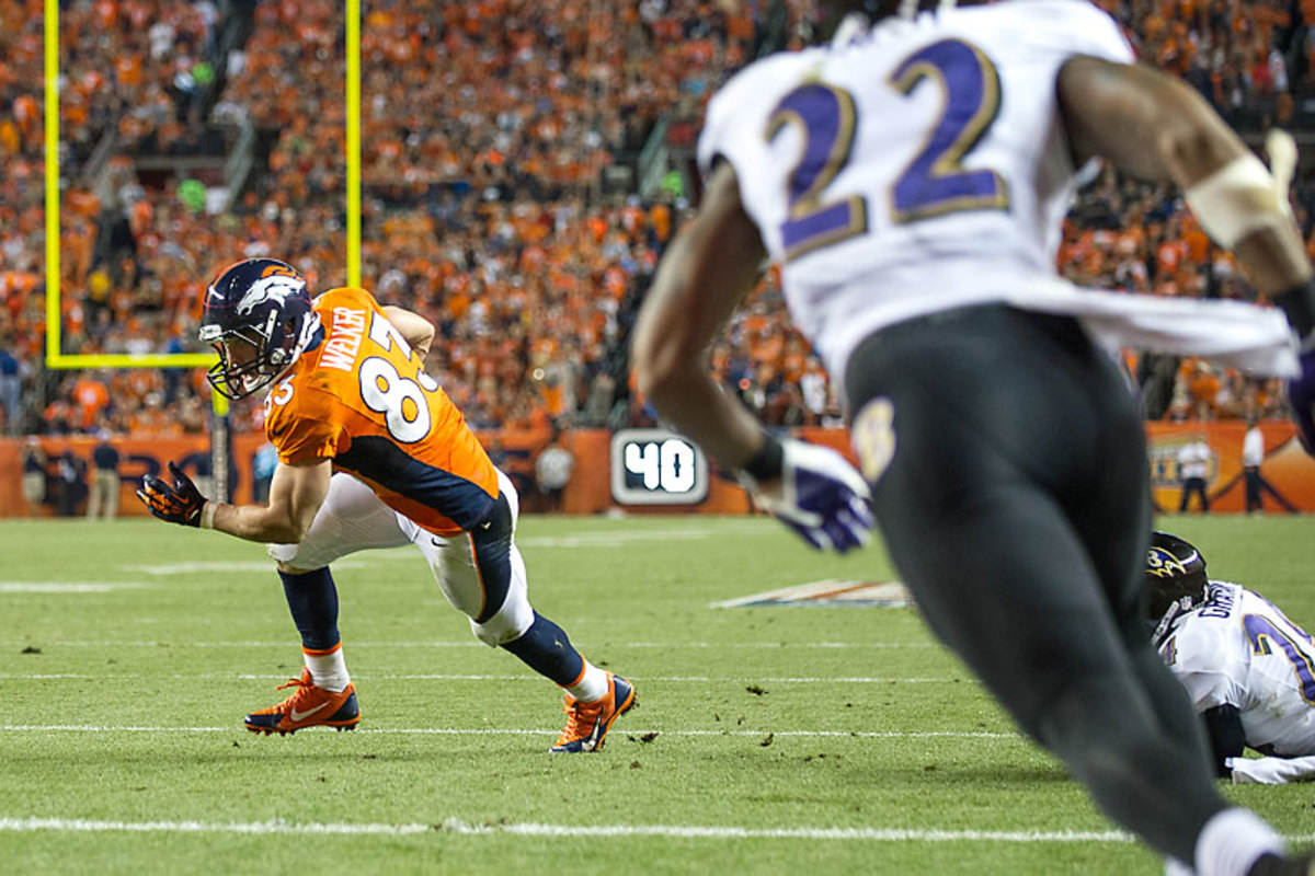 Wes Welker, the new guy in town, had two TDs among his nine receptions. (Dustin Bradford/Getty Images)