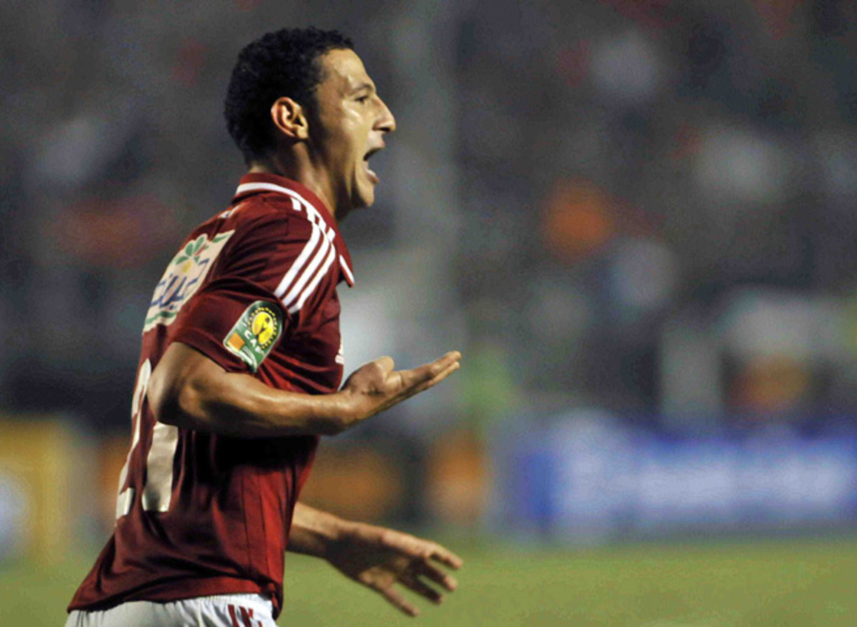 Al Ahly's Ahmed Abdul Zaher gives a four-fingered salute after scoring in the African Champions League final last Sunday. His club will sell him as a result of the gesture, which has political ties.