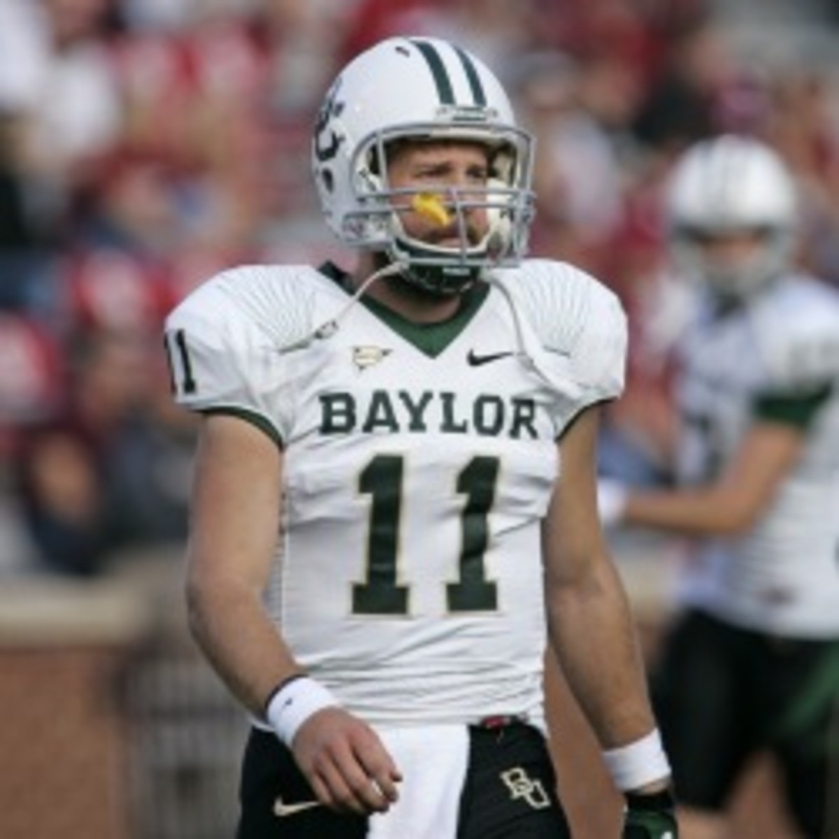 Former Baylor quarterback Nick Florence will not enter the draft, but instead will pursue his master's degree. (Brett Deering/Getty Images)