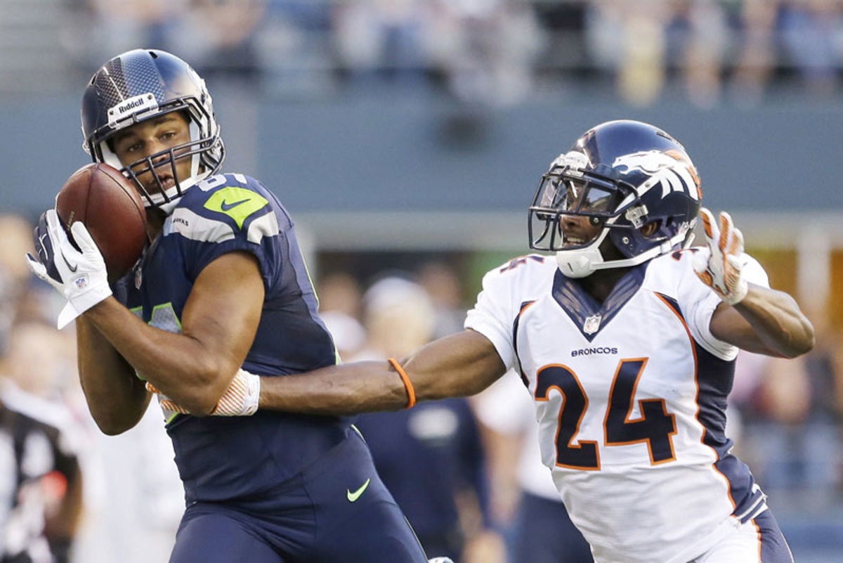 Golden Tate, looking a lot like Torrey Smith  last January, got the best of Champ Bailey in the Seahawks-Broncos game. (Elaine Thompson/AP)