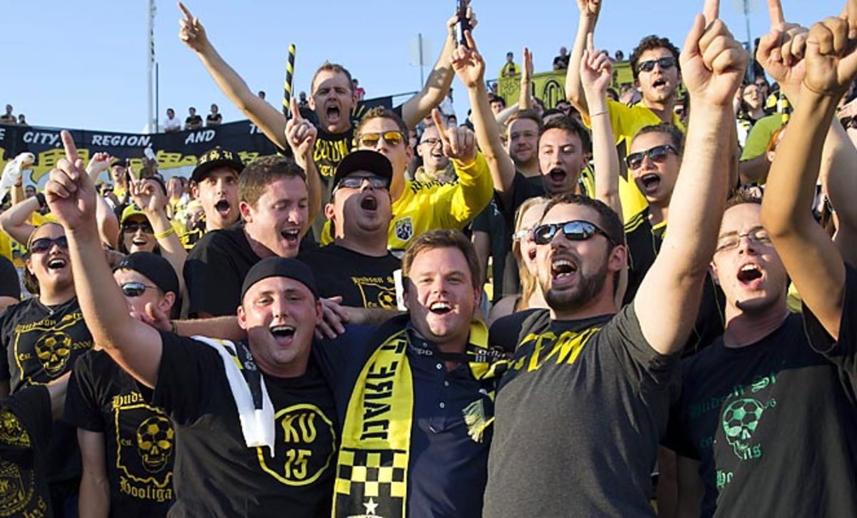 New Crew owner Anthony Precourt (center) observed a recent game with the club's most ardent fans.