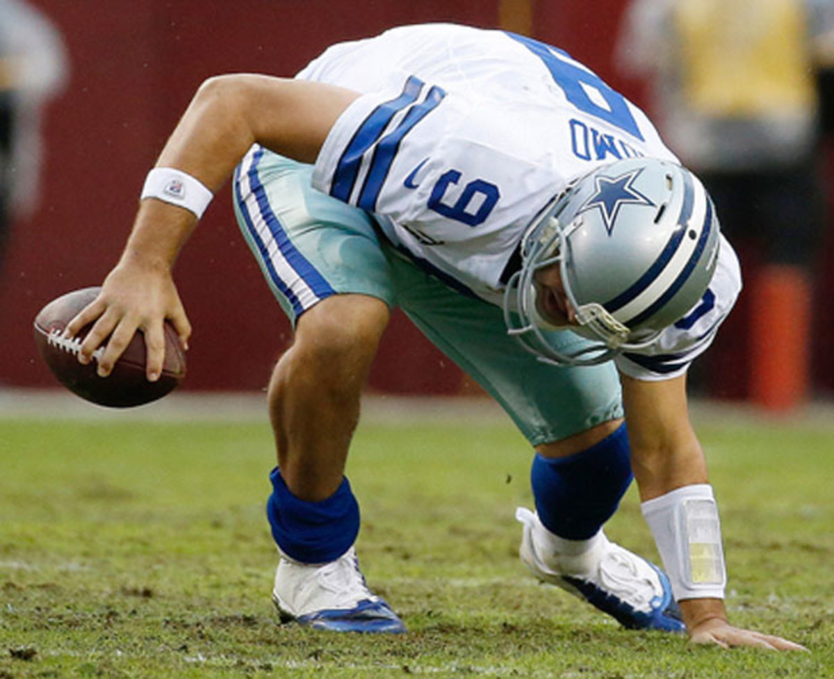 Tony Romo reportedly threw the game-winning touchdown pass with a herniated disk.  (AP)