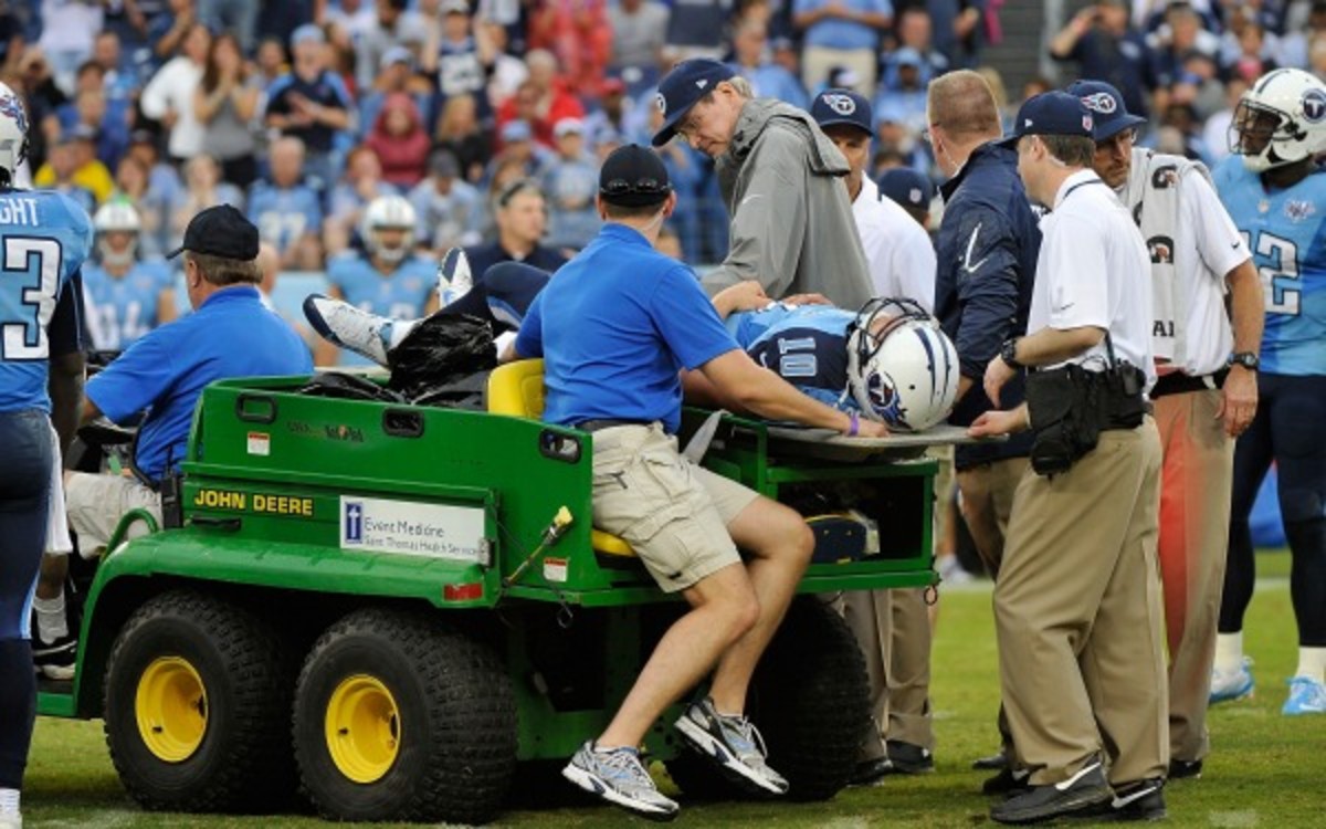 Titans quarterback Jake Locker was carted off after spraining his hip Sunday. (Frederick Breedon/Getty Images)