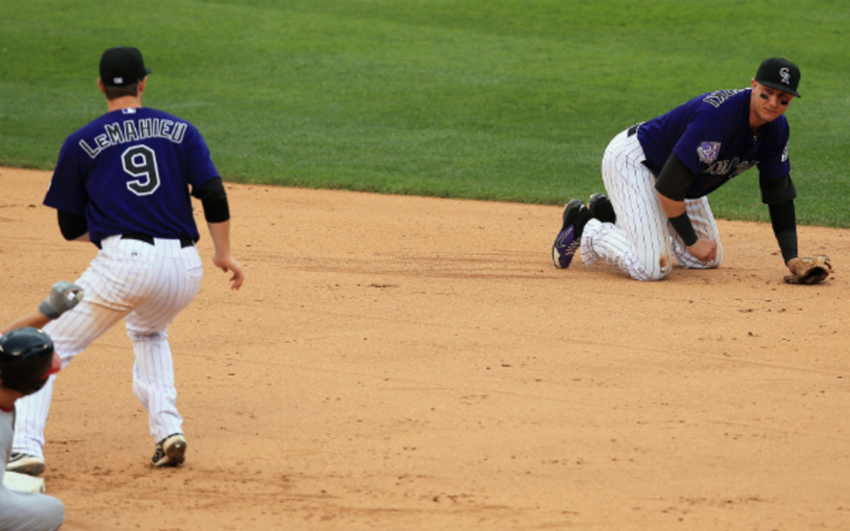 Troy Tulowitzki was injured on Wednesday while diving to stop a ground ball. (Doug Pensinger/Getty Images)