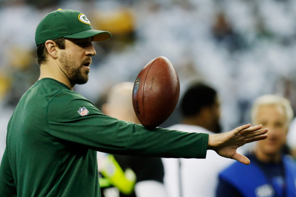 Aaron Rodgers has found other ways to occupy his time since breaking his collarbone. (Tim Sharp/AP)