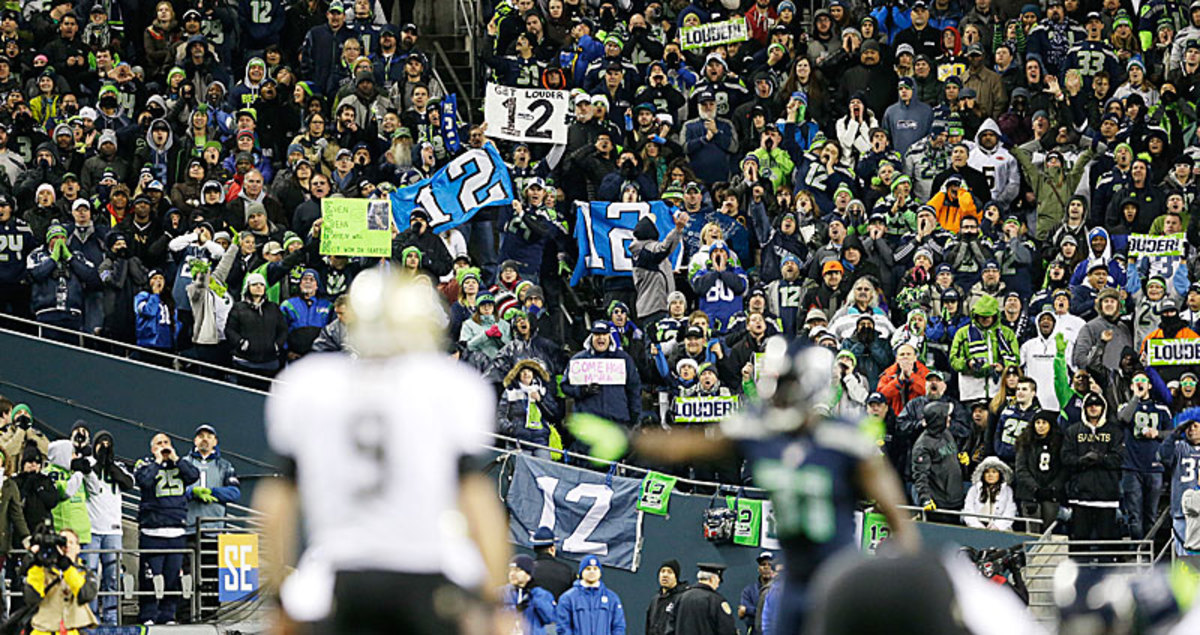 The practical effect of the crowd noise at CenturyLink is to prevent opponents from audibling or getting exotic, forcing them instead into more basic schemes. (Elaine Thompson/AP)