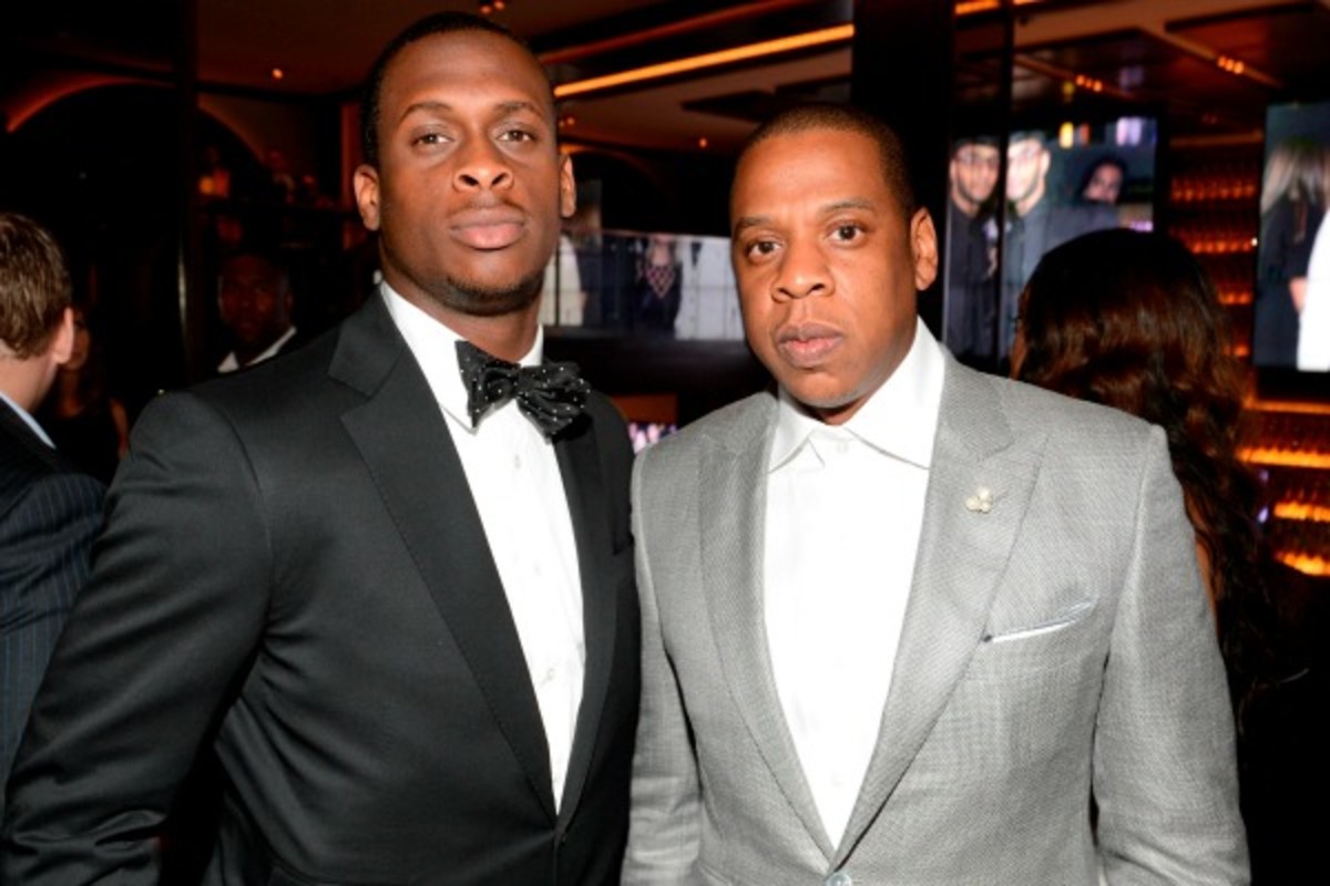 Geno Smith (left) signed with Jay-Z's Roc Nation Sports agency to negotiate his NFL rookie contract. (Kevin Mazur/Getty Images)