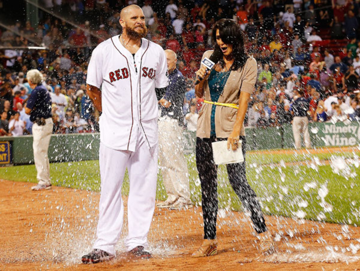 Red Sox Jonny Gomes and Jenny Dell get doused with water