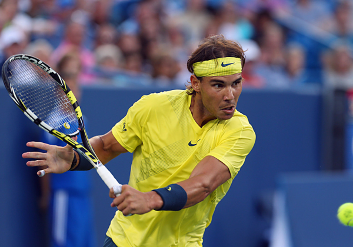 Rafael Nadal continued his unbeaten string on hard courts in 2013 ith a win over Roger Federer in the Cincinnati quarterfinals. (Ronald Martinez/Getty Images)
