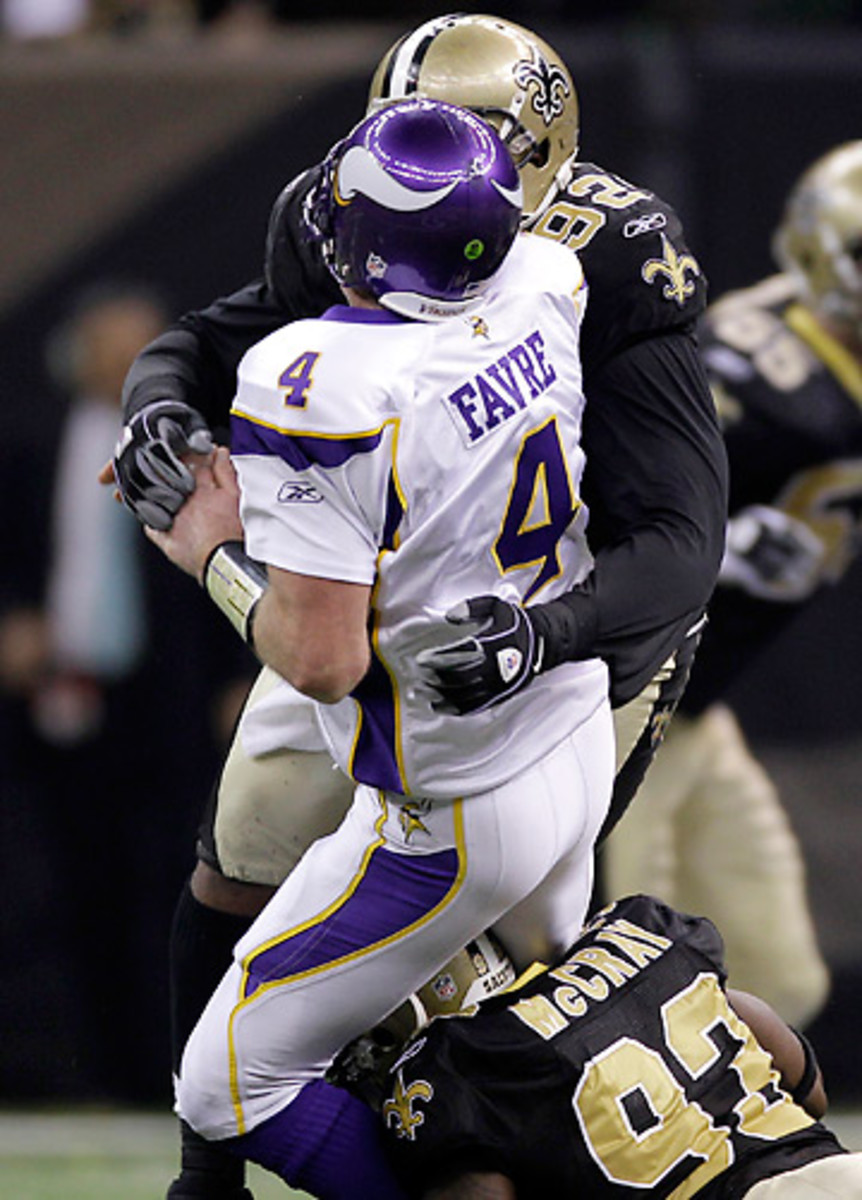 Brett Favre has a reputation for playing through pain, something he did a lot of against the Saints. (Mark Humphrey/AP)