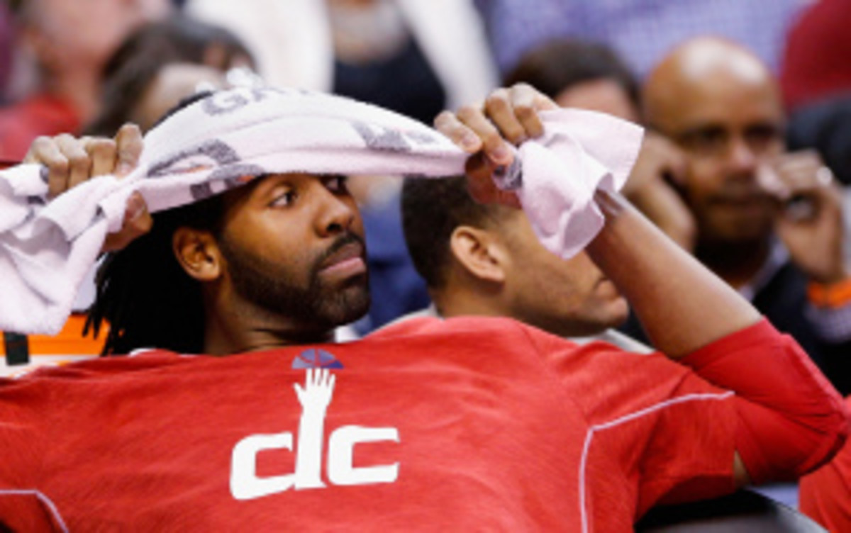 Wizards center Nene is questionable for Friday's home opener vs. the Sixers. (Rob Carr/Getty Images)