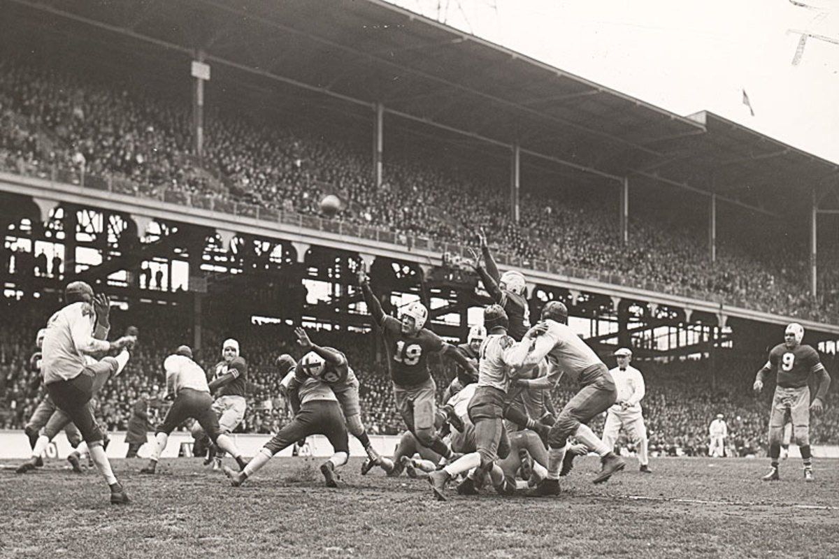 A master of the quick kick, Baugh would use the surprise punt as a field-position weapon; it undoubtedly boosted his yardage totals since there were no return men. (International News Photos) 