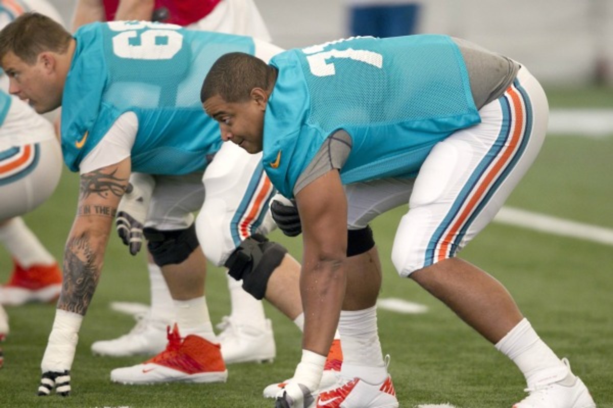 Jonathan Martin won't play for the rest of the 2013 season. (Joe Rimkus Jr./Getty Images)