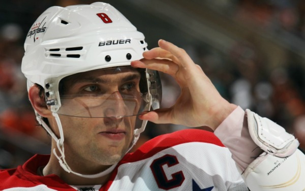 Alex Ovechkin and other NHL veterans can opt whether or not to wear visors in 2013-14. (Bruce Bennett/Getty Images)
