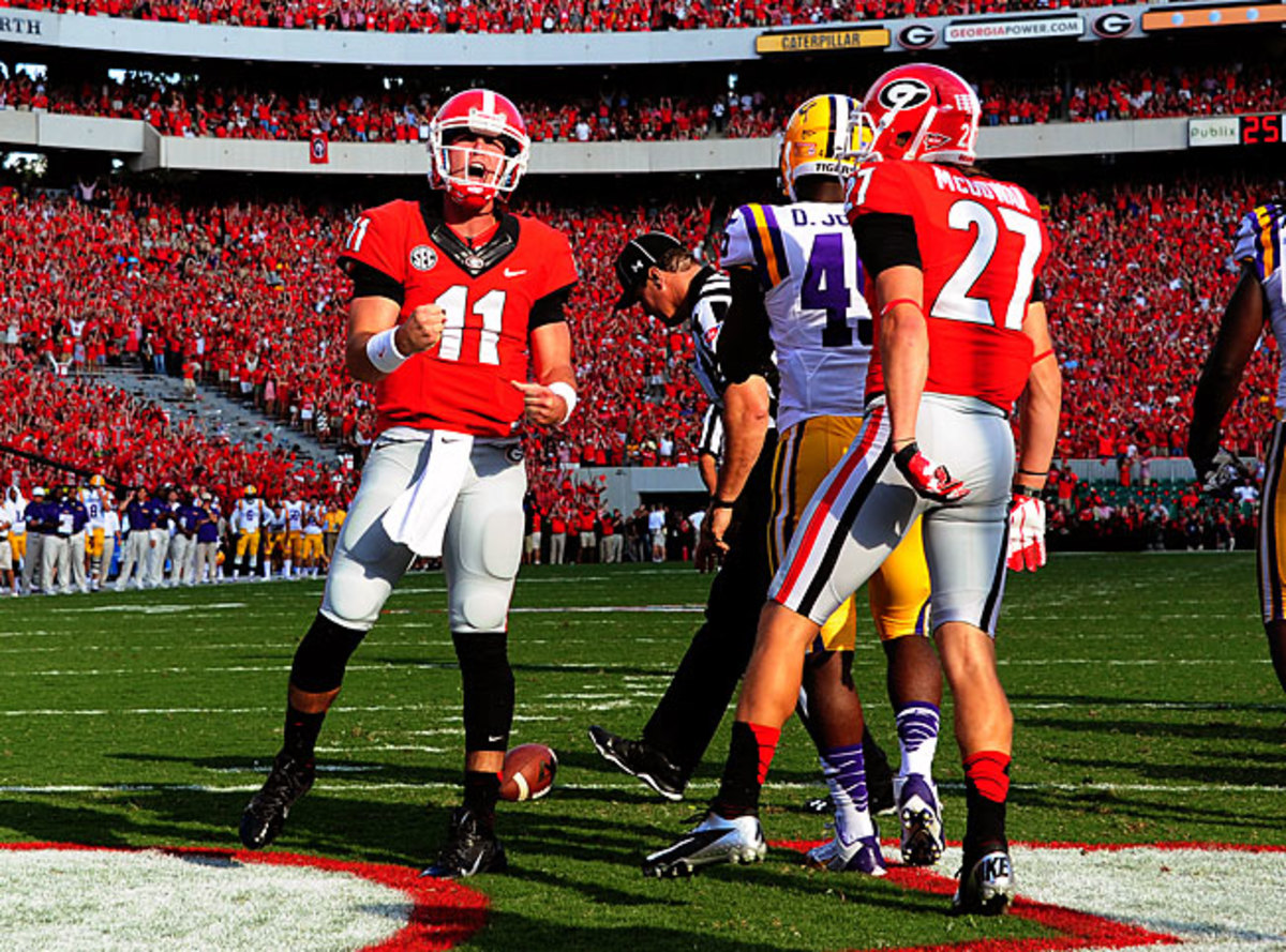 Aaron Murray (11) threw for 298 yards and four touchdowns to help Georgia outlast LSU in a shootout.