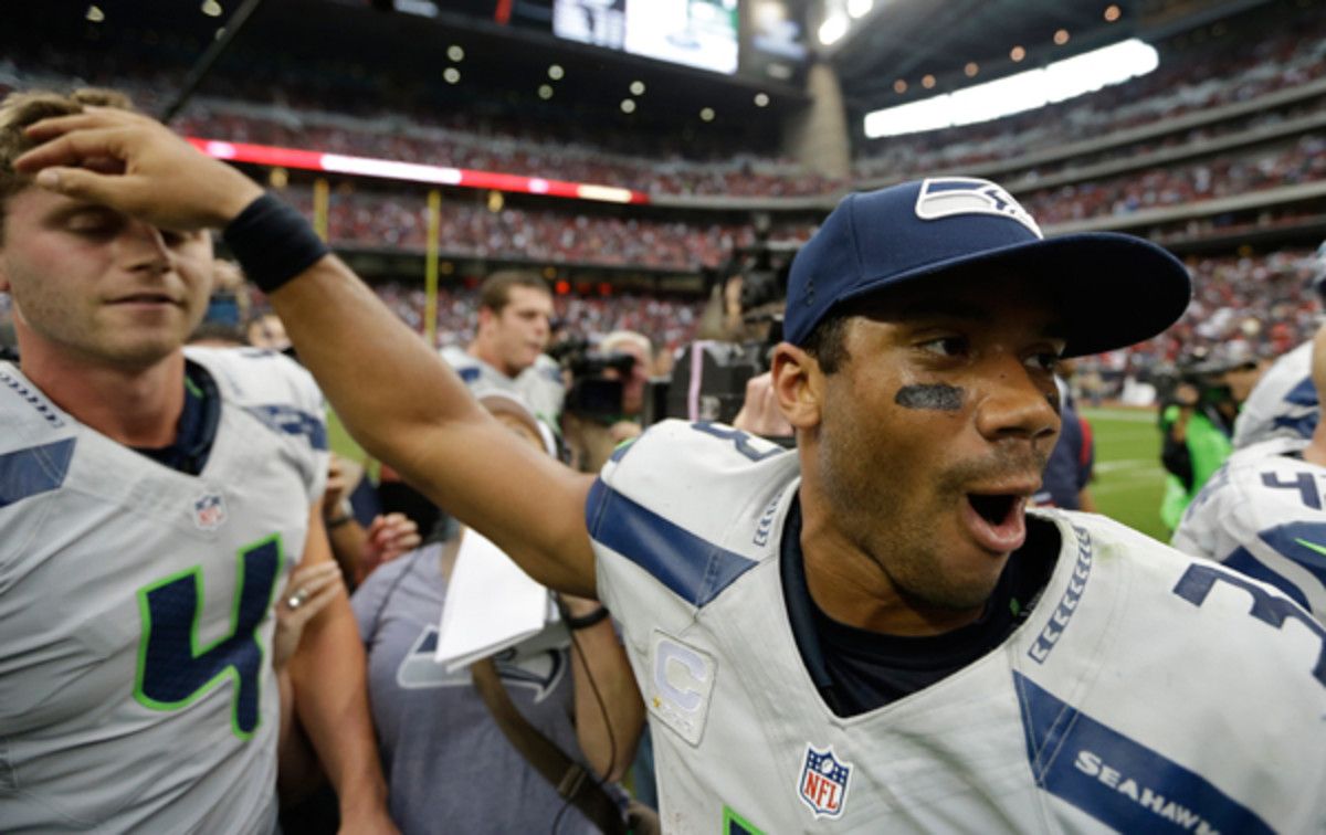 Russell Wilson rubs Steven Hauschka's head after the Hauschka's game-winning field goal.