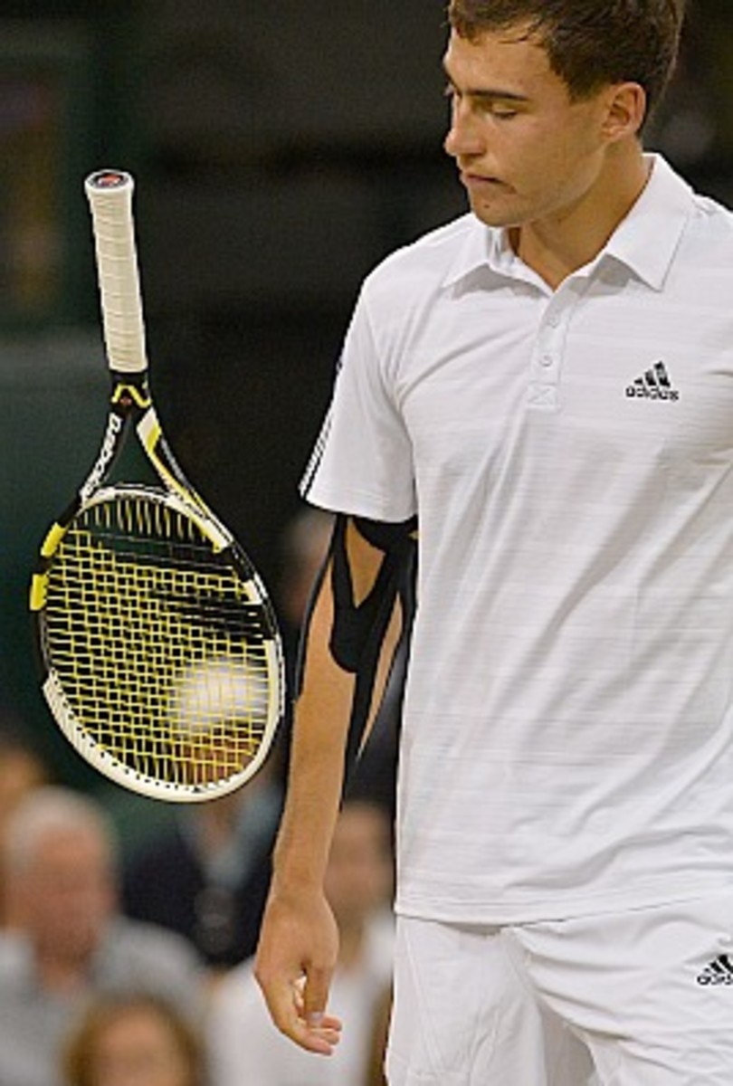 Janowicz has never played under the Centre Court roof until today. (Carl Court/AFP/Getty Images)