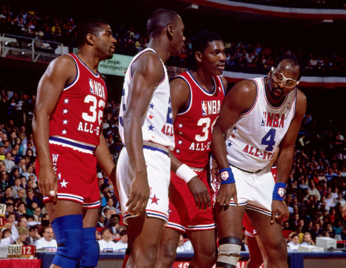 Magic Johnson, Michael Jordan, Hakeem Olajuwon and Moses Malone catch their breath during the 1988 All-Star Game. (Getty Images) 
