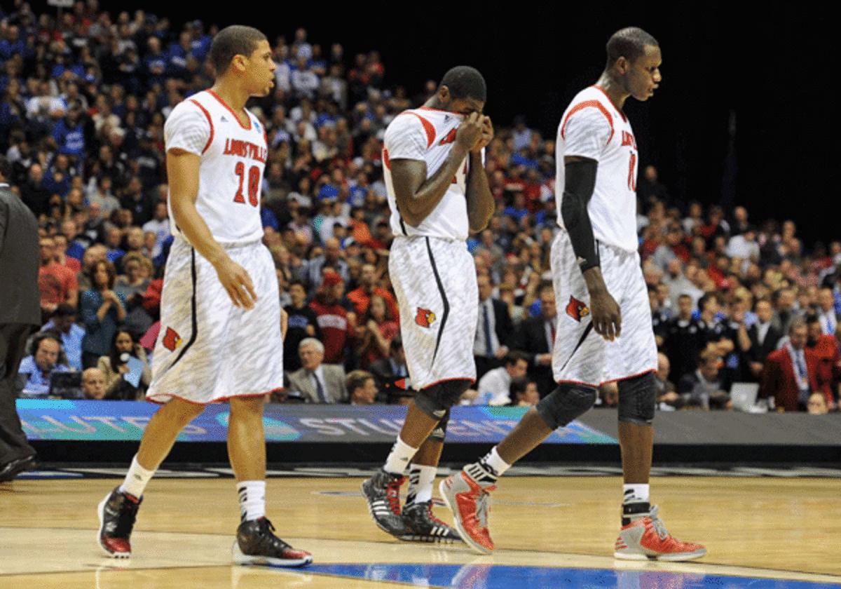 Louisville players reacted to teammate Kevin Ware's gruesome leg injury against Duke. (SI)