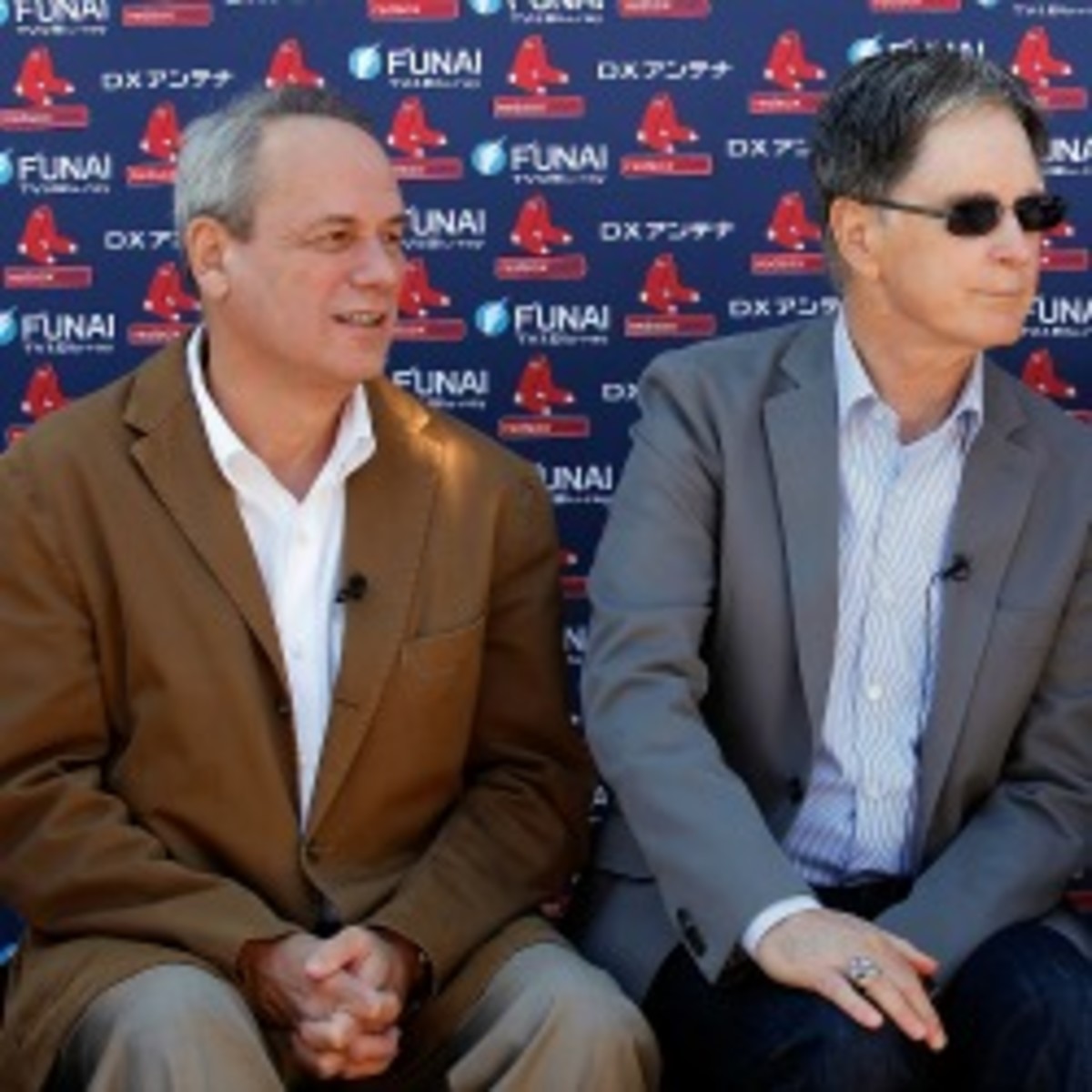 Red Sox President/CEO Larry Lucchino (left) and owner John Henry have been involved in the medical staff saga that has divided the team over the past several years. (J. Meric/Getty Images)