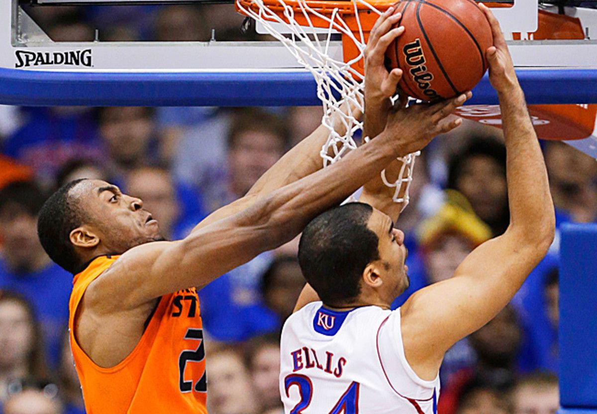 Markel Brown blocks the shot of Perry Ellis as OSU snapped Kansas' 18-game winning streak.