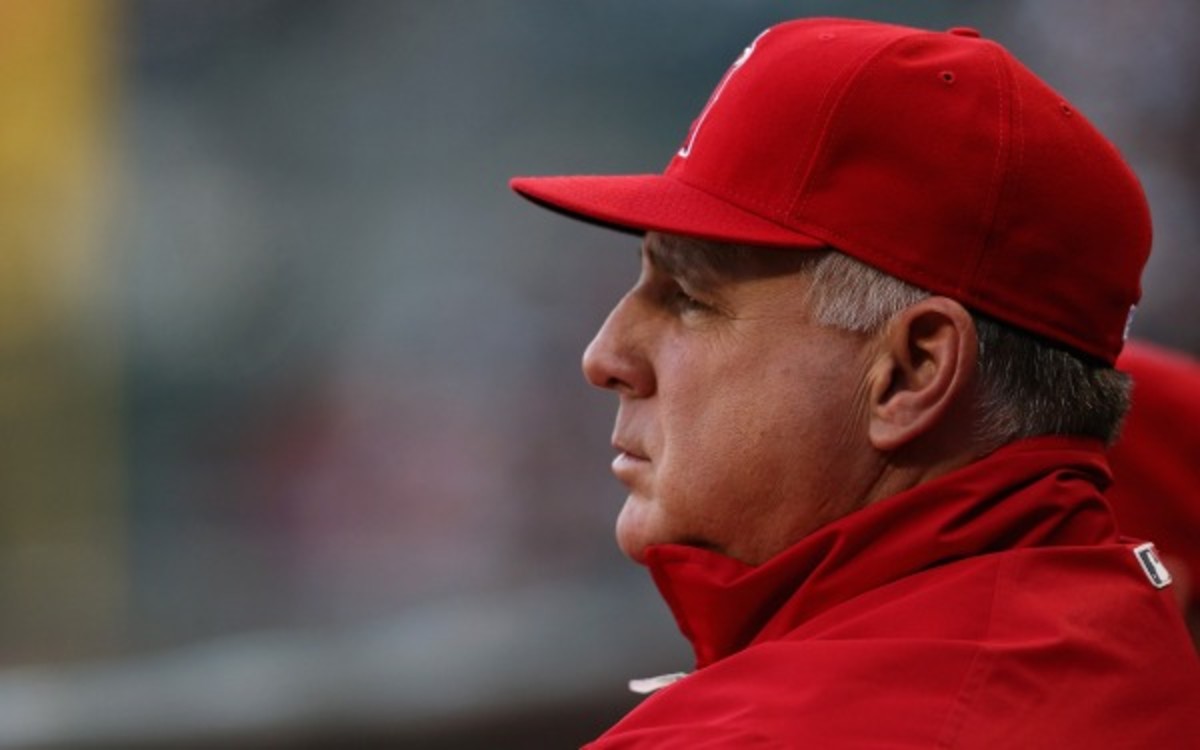 Angels manager Mike Scioscia's job is safe this season, according to the team's owner. (Jonathan Daniel/Getty Images)