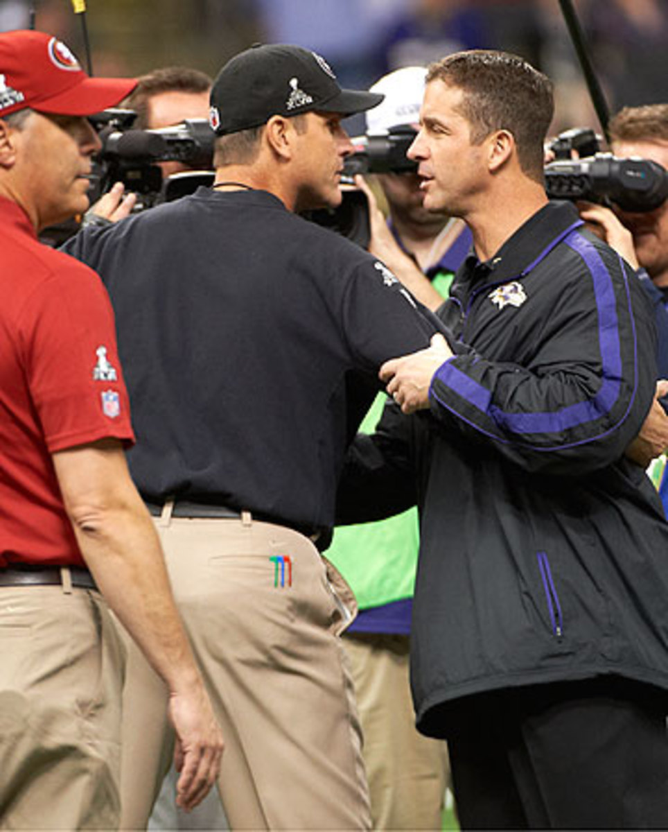 John (right) got a nice bump from the Ravens after beating Jim in the Super Bowl. (John Biever/Sports Illustrated)