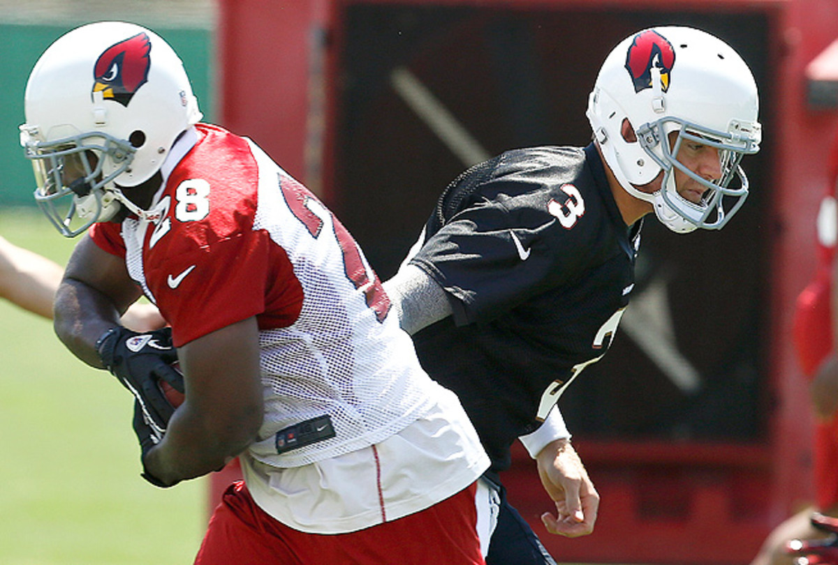 Rashard Mendenhall was named the Cardinals' starter after running with the first team in OTAs.