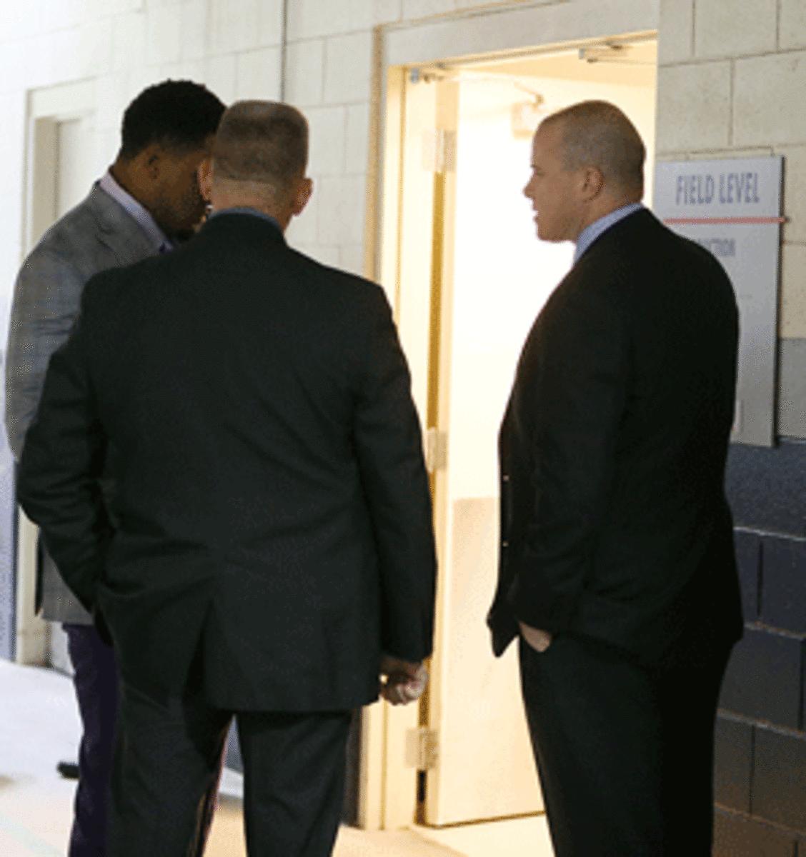 Massachusetts State Police surprised Dolphins center Mike Pouncey (in gray jacket) with a grand jury subpoena after Sunday's game with the Patriots in Foxborough, Mass.
