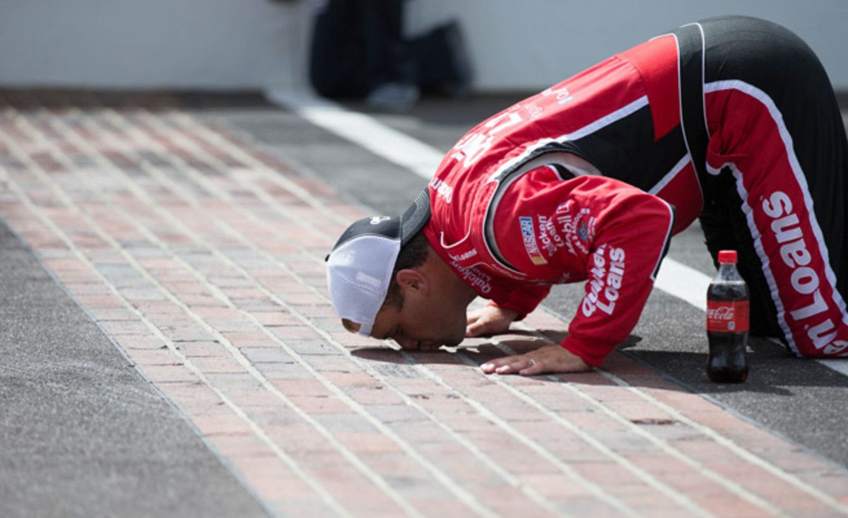 Ryan Newman kisses the bricks after winning the Samuel Deeds 400 at the Indianapolis Motor Speedway in June.