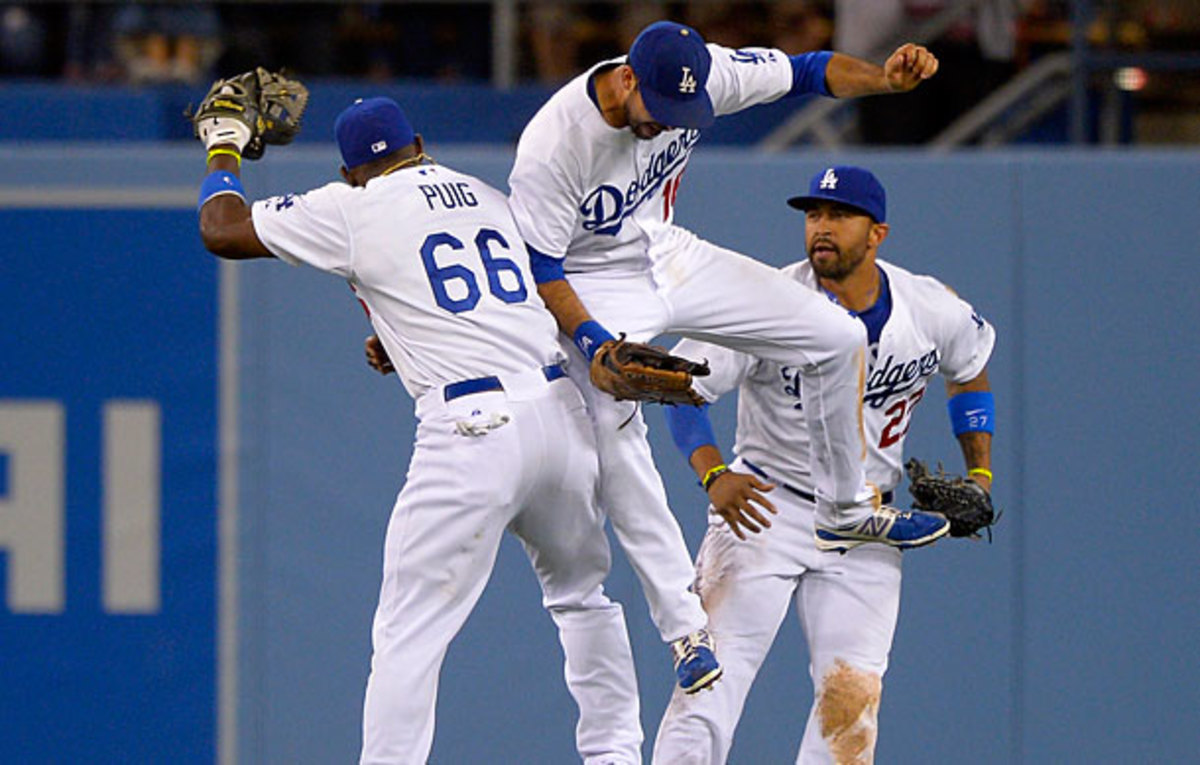 Surrounded by stars like Yasiel Puig and Matt Kemp, Andre Ethier (center) could be pushed out of Los Angeles. (Mark J. Terrill/AP)