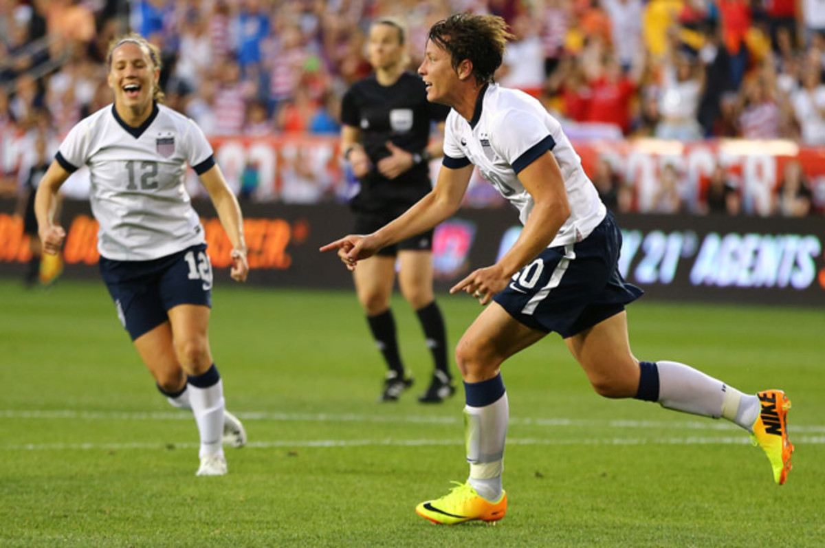 Abby Wambach celebrates after scoring her 159th career goal, breaking Mia Hamm's all-time mark.