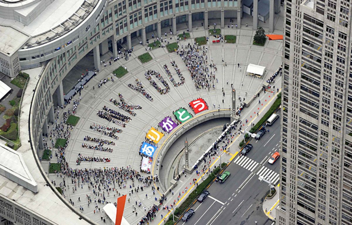 Tokyo residents spell out the words 'Thank You' in celebration of winning the 2020 Olympics.