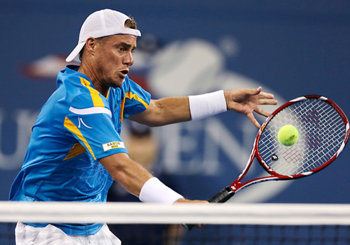 Less than two years after surgery left his career in limbo, Lleyton Hewitt upset No. 6 Juan Martin del Potro at the U.S. Open. (Clive Brunskill/AP)