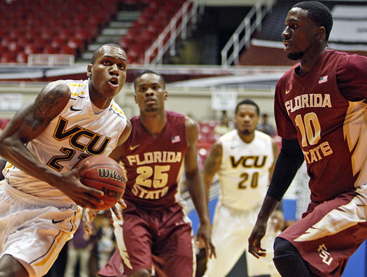 Okaro White (right) and Florida State put the clamps on VCU's offense en route to an upset win. (Ricardo Arduengo/AP)