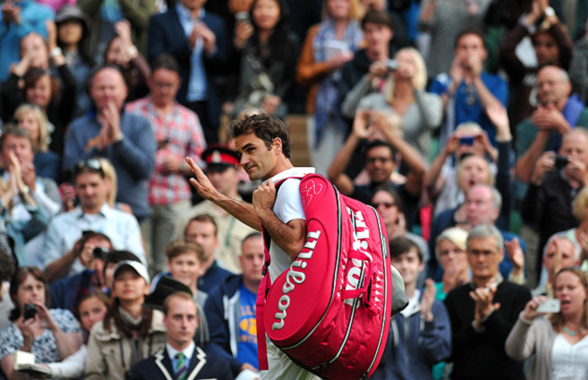 Roger Federer walks off the court after a shocking loss in the second round to Sergiy Stakhovsky.