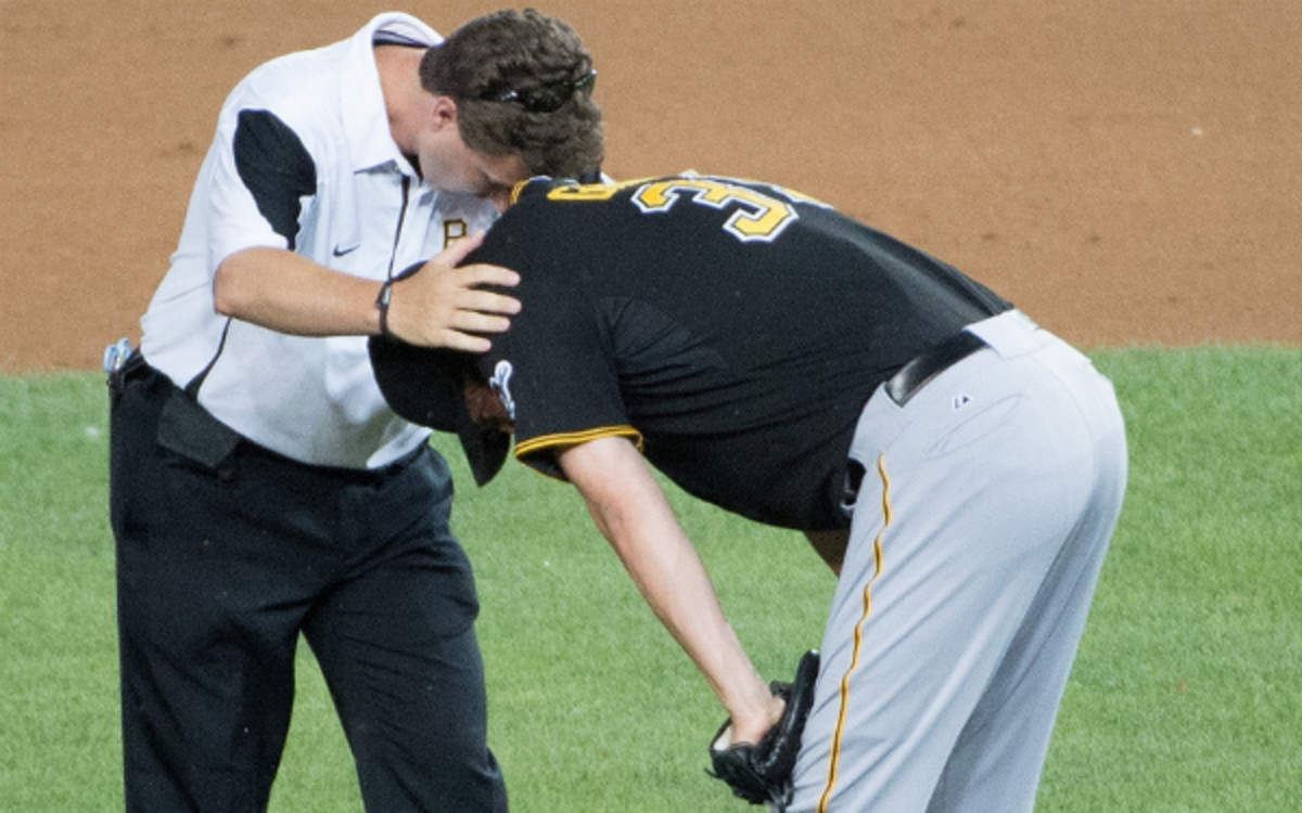 Jason Grilli bends down after suffering an arm injury on Monday. (MCT/Getty Images)