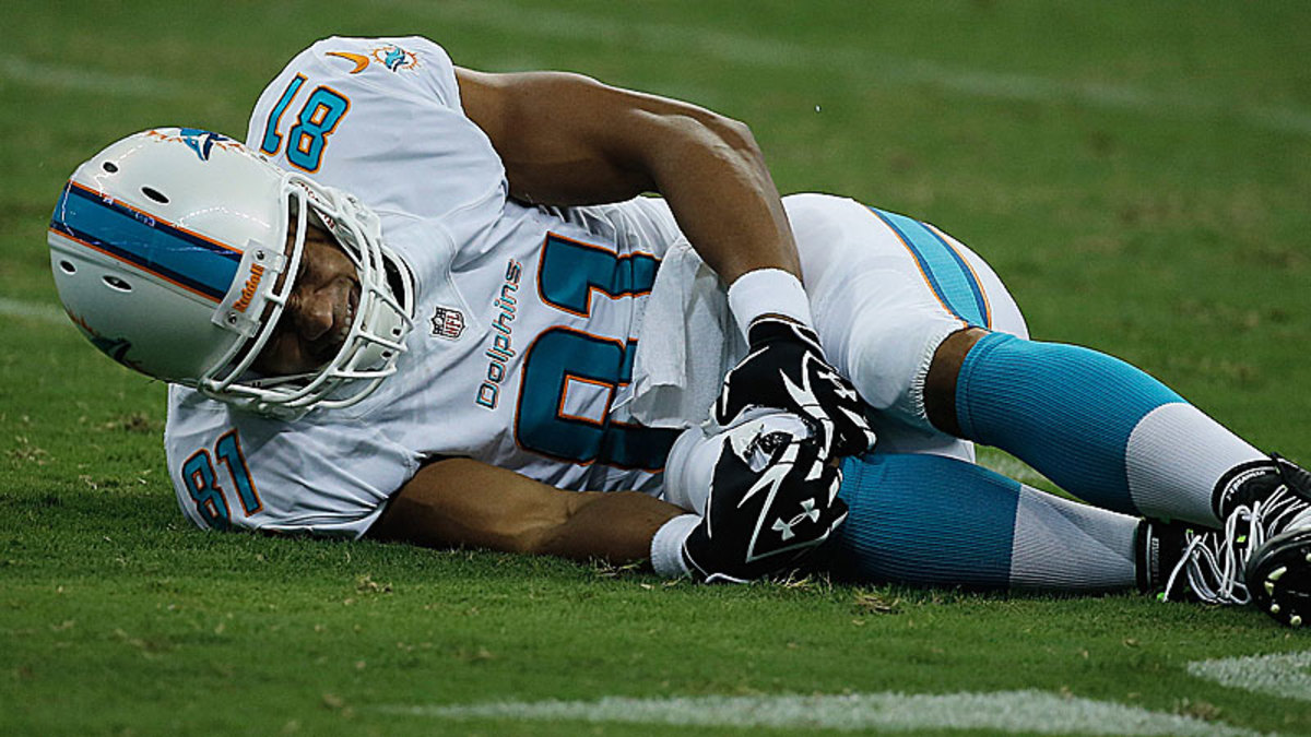 D.J. Swearinger's hit on Dustin Keller, which ended Keller's season, helped give further life to the theory that protecting player's heads is just going to result in more injuries to the knees. (Scott Halleran/Getty Images)