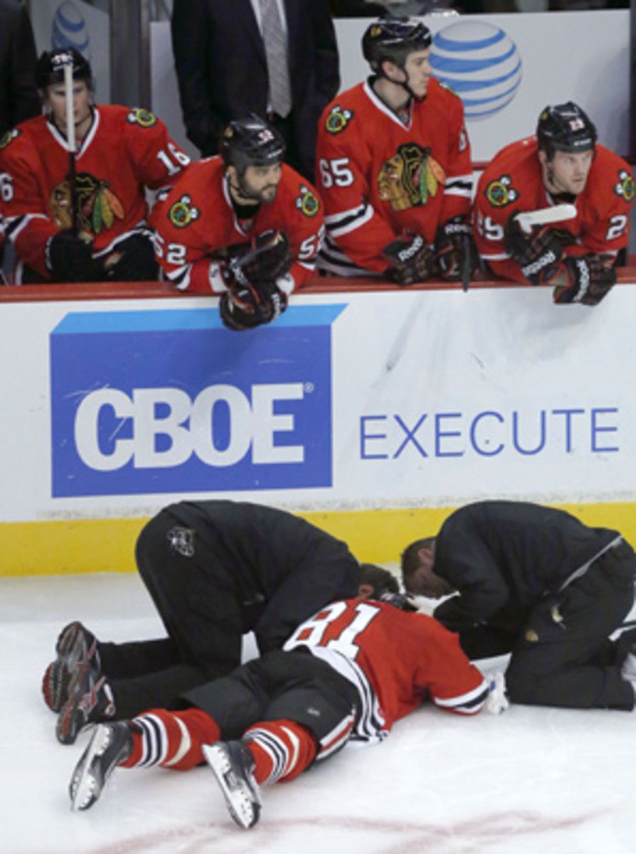 Marian Hossa (81) was knocked out of the game by Jannik Hansen on Wednesday.