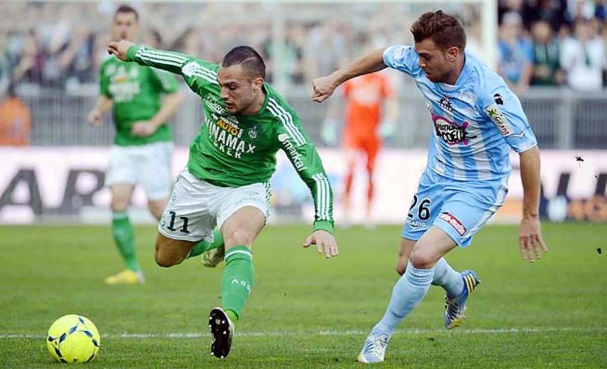 Saint-Etienne midfielder Yohan Mollo (left) vies with Ajaccio defender Samuel Bouhours.