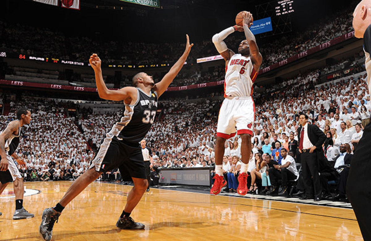A headband-less LeBron James drilled an open three-pointer to cut the Spurs' lead to two points.