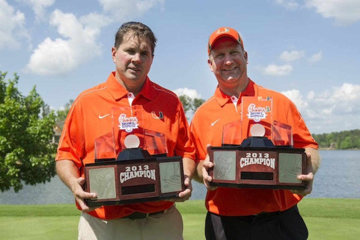 Al Golden takes the first crystal ball trophy of the season. It is a golf ball. (Courtesy of the Chick-fil-A Bowl)
