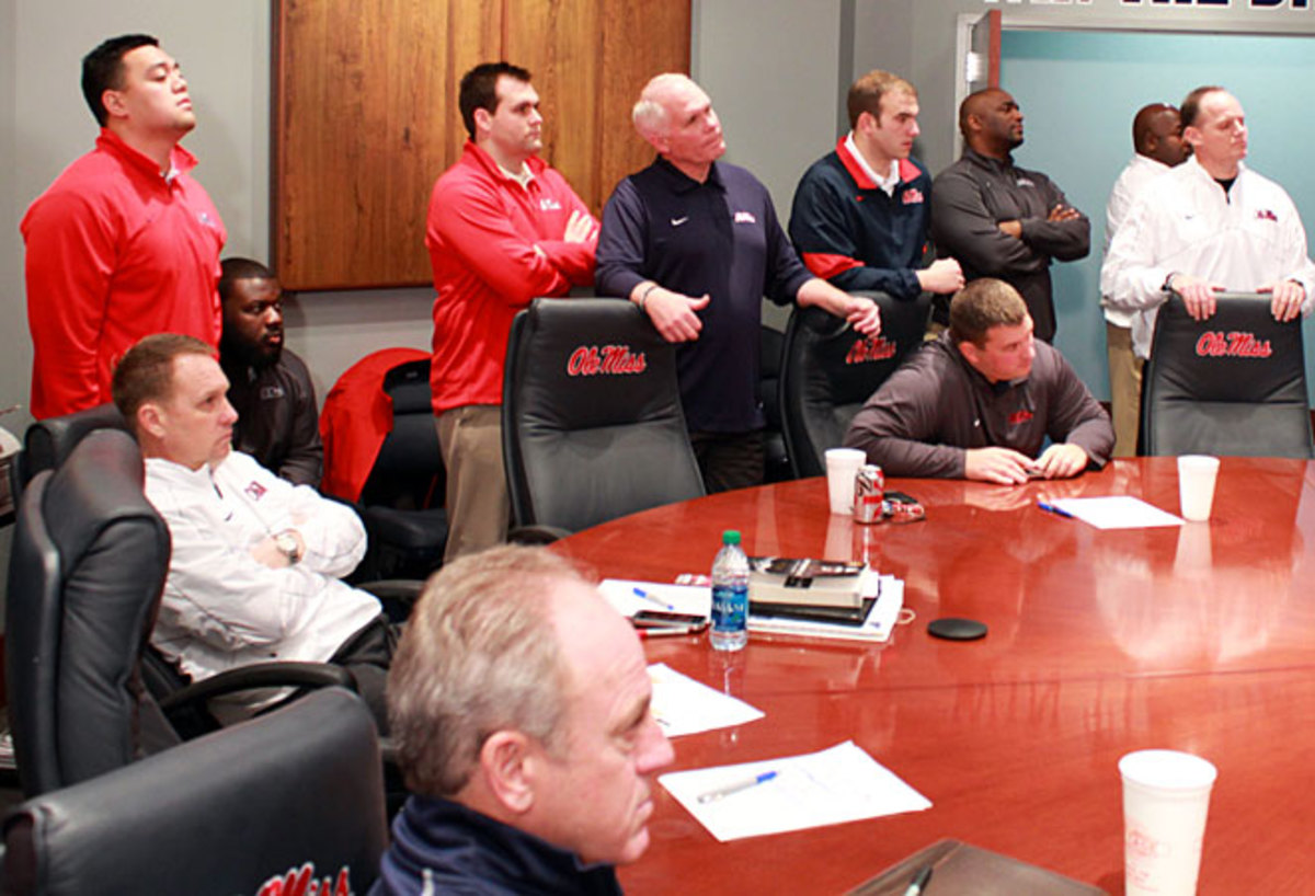 Ole Miss coaches watch as heralded defensive end Robert Nkemdiche announces his college destination.
