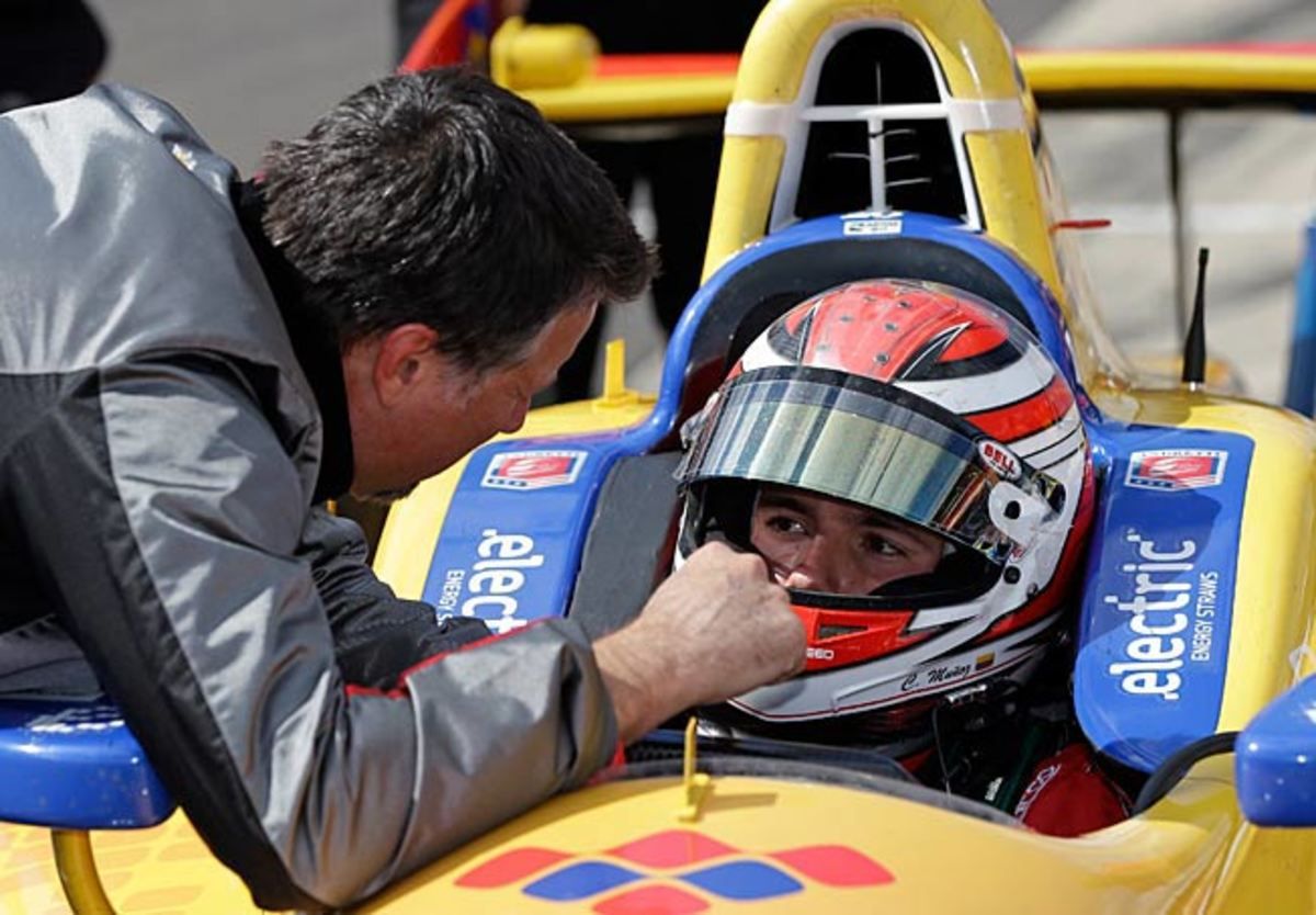 Michael Andretti chats with Carlos Munoz, who passed his rookie test last Saturday.