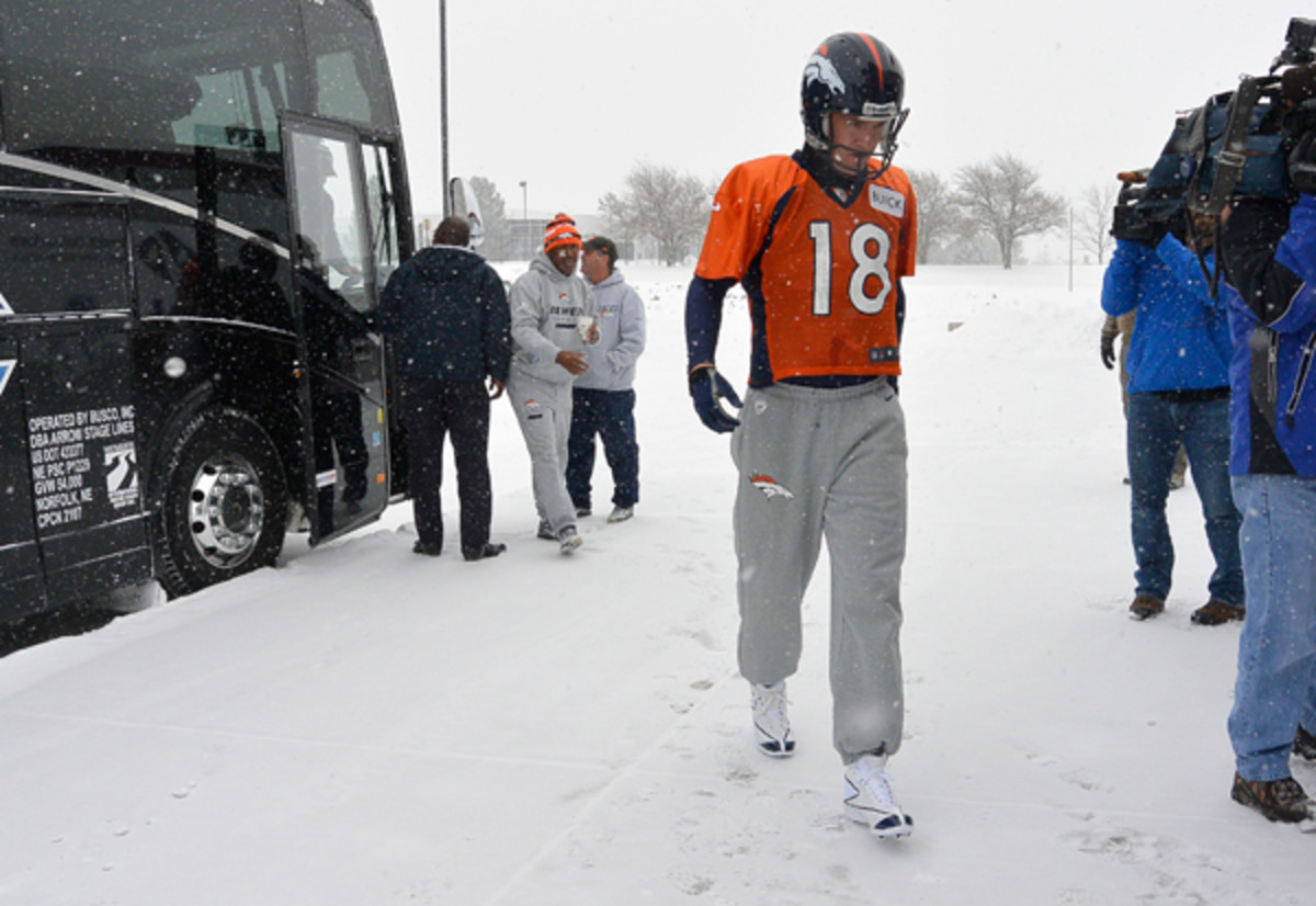 Peyton Manning heads to the Broncos' practice bubble on Wednesday (John Leyba/Getty Images)